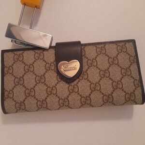Heart Continental monogram Gucci wallet.